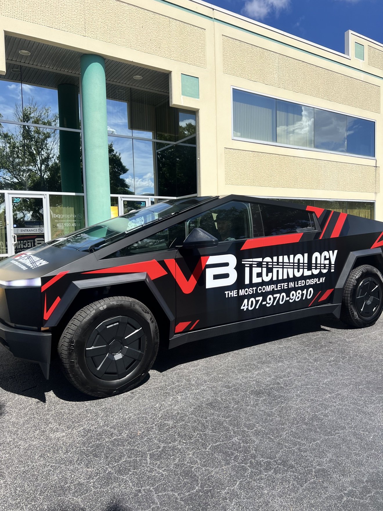 Tesla Cybertruck with a full commercial wrap for VB Technology, side profile