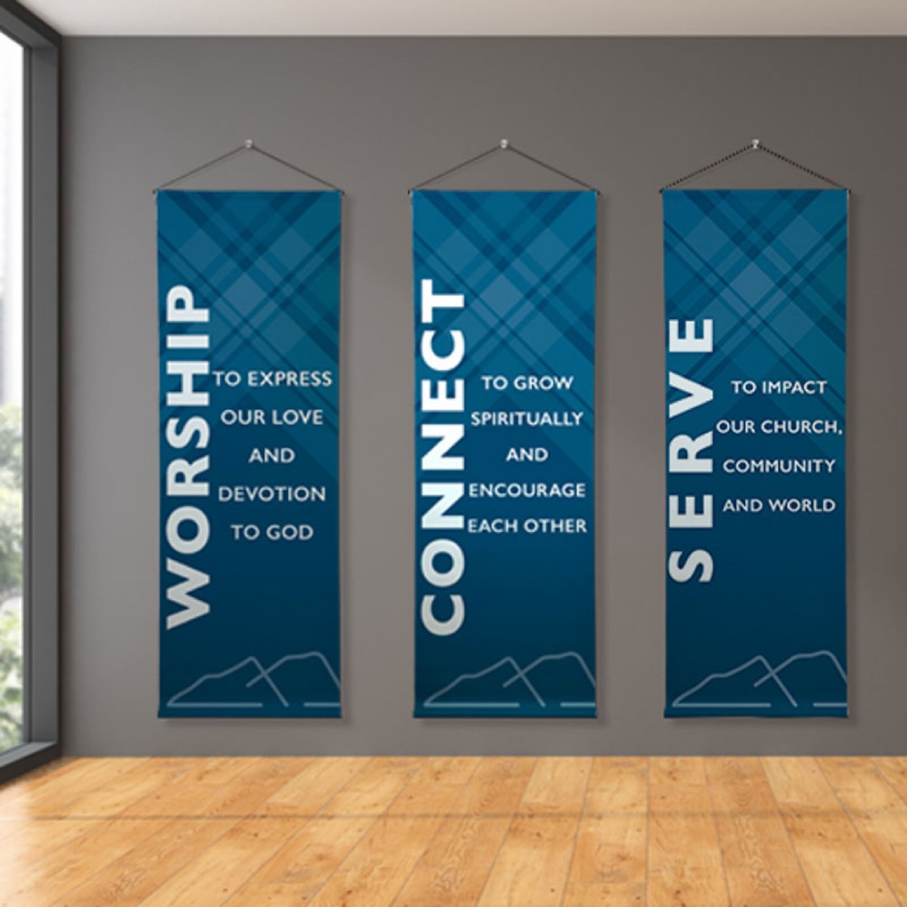 Three vertical blue church banners hanging on a wall, reading Worship, Connect and Serve